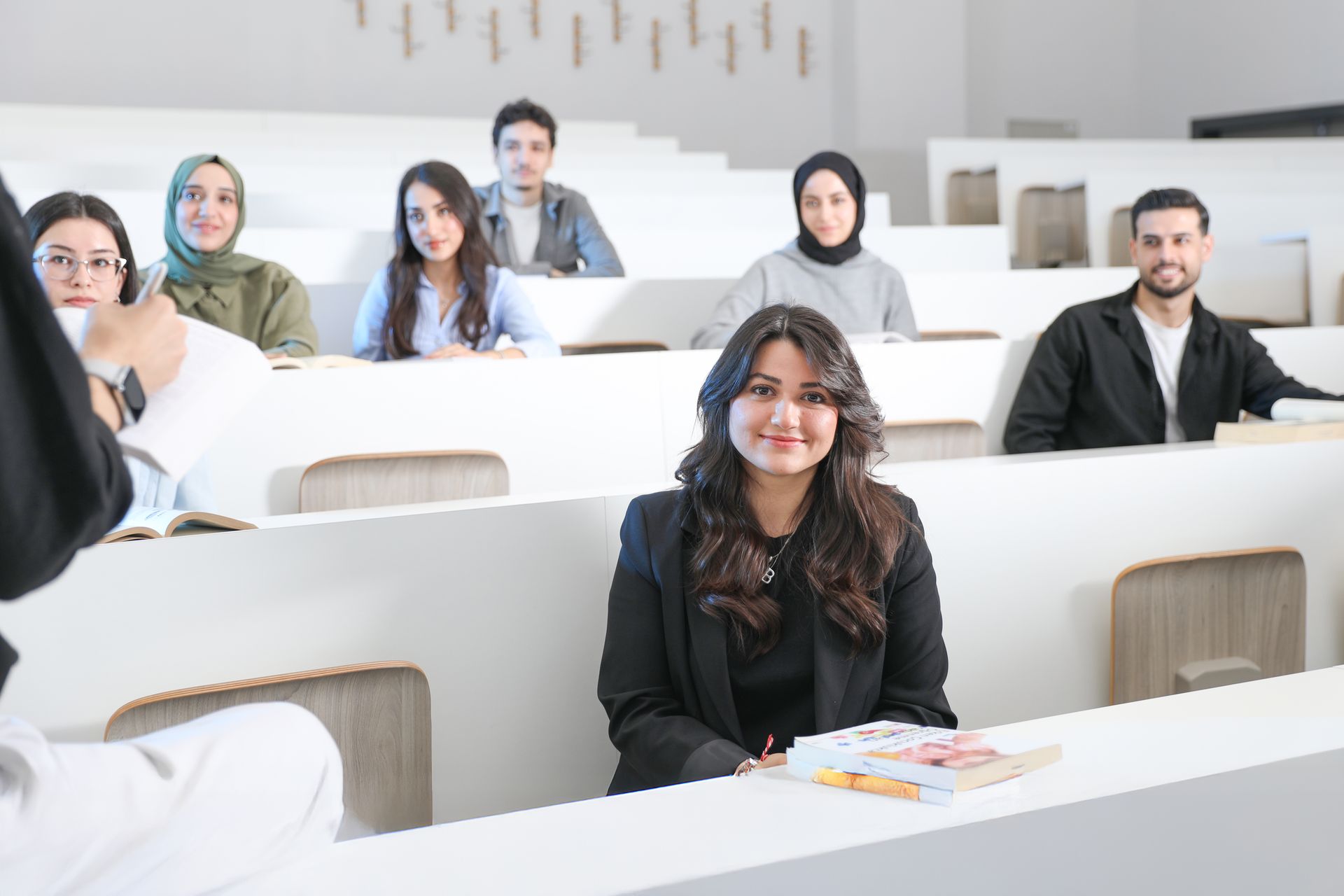 Diverse group of students in a modern university lecture hall